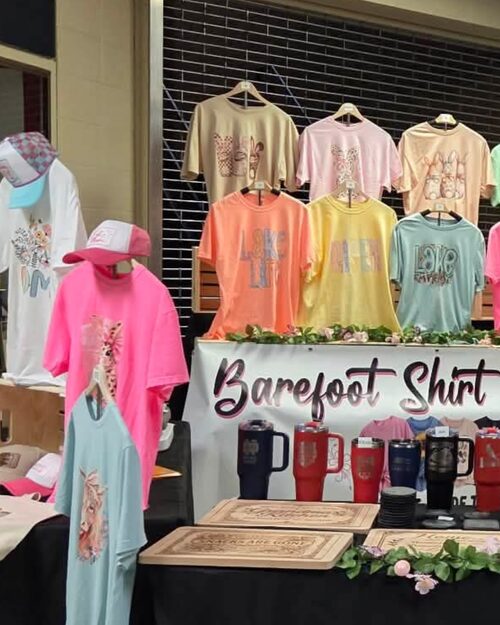 Barefoot Shirt Designs market booth display